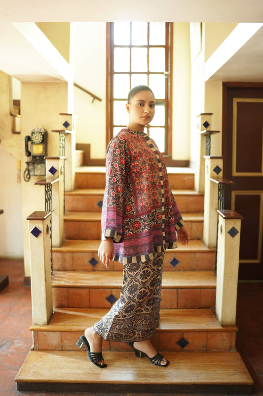 “Side profile of rust printed top and wide-leg pants – women’s co-ord set”