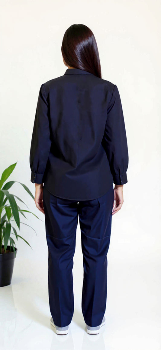 Person wearing a navy blue outfit on a white background