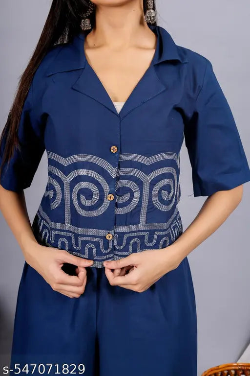 Blue outfit with a patterned design on a gray background