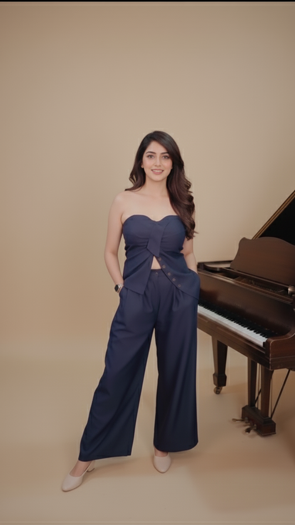 Front view of navy blue strapless bow top and wide-leg pants co-ord set for women.