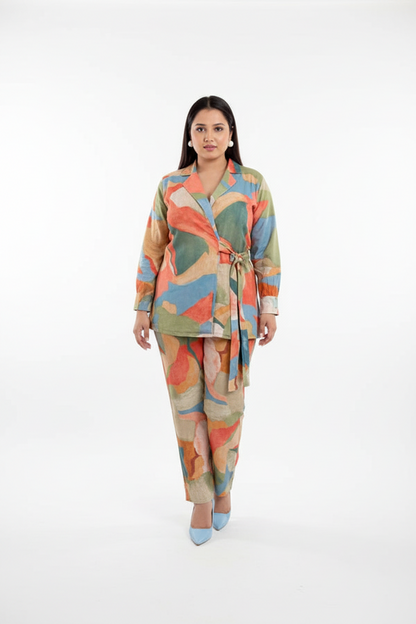 Woman wearing a colorful patterned outfit on a white background