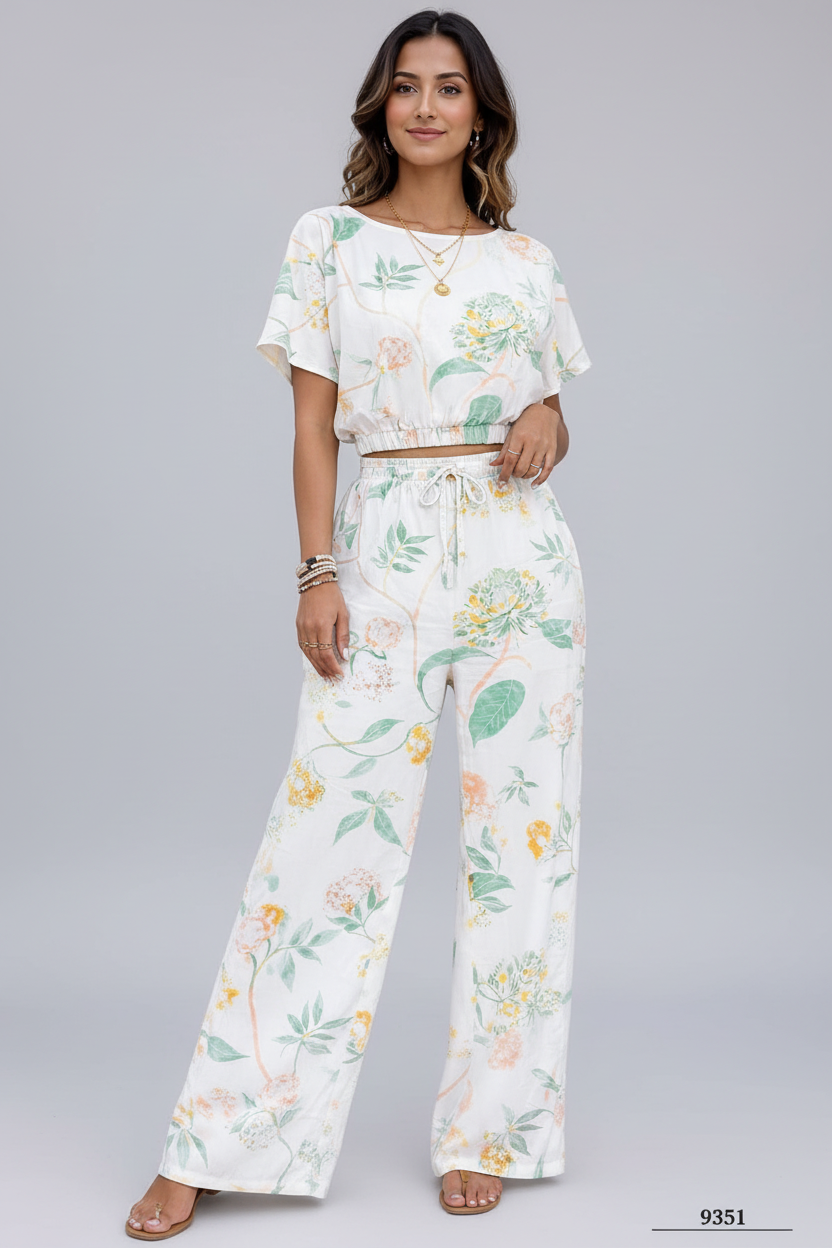 Woman wearing a floral outfit on a gray background