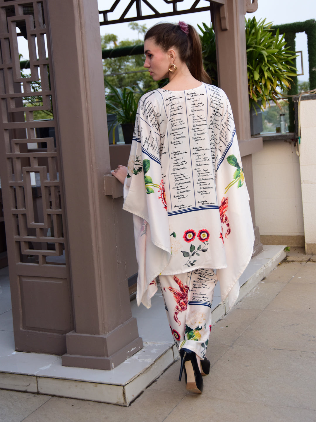 "Woman wearing a floral and script print cotton co-ord set – stylish and elegant outfit for women by PoshBella, perfect for casual and festive wear."