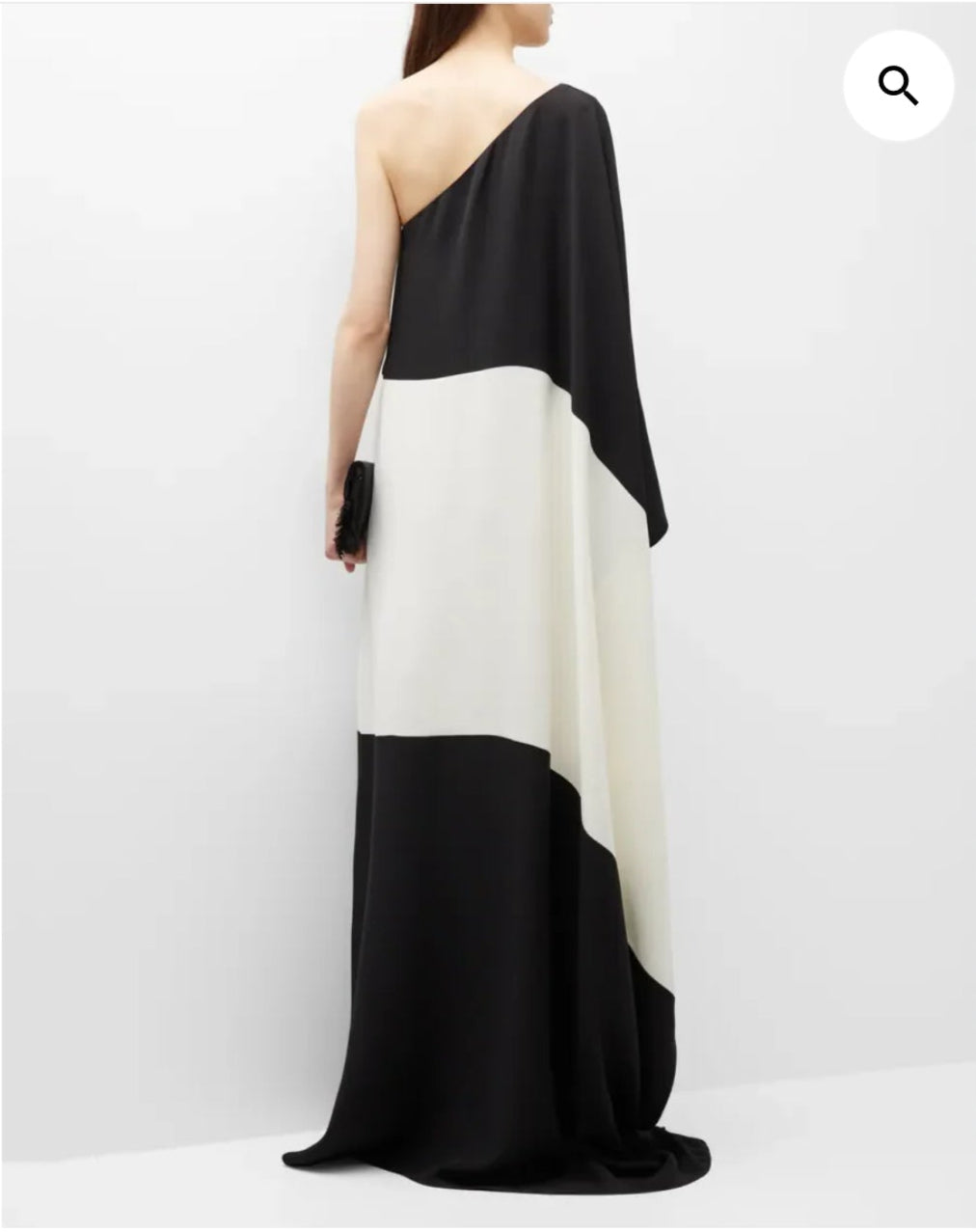 Black and white one-shoulder dress on a model against a white background