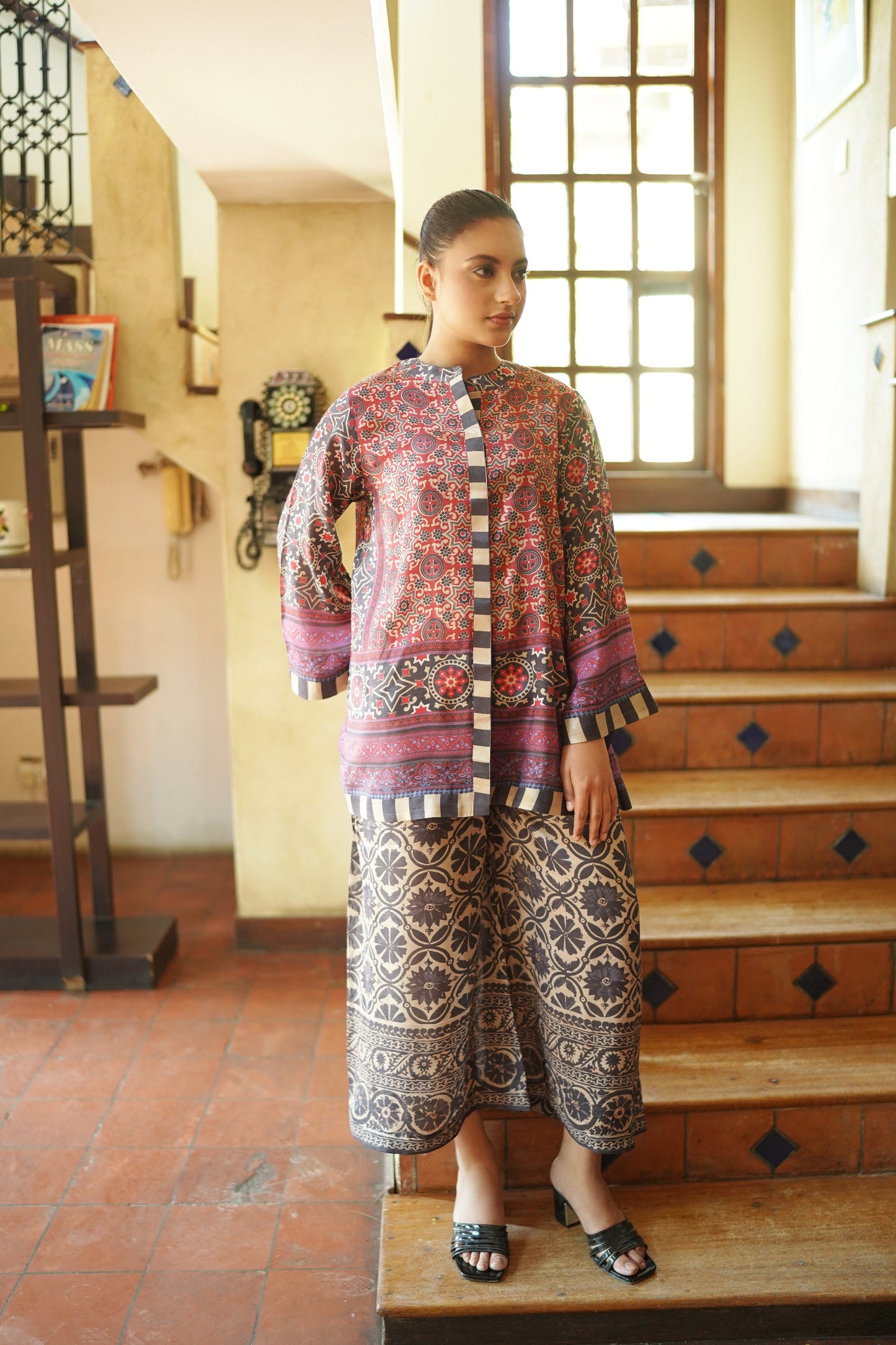 “Front close-up of printed top and patterned pants – rust mosaic co-ord set”
