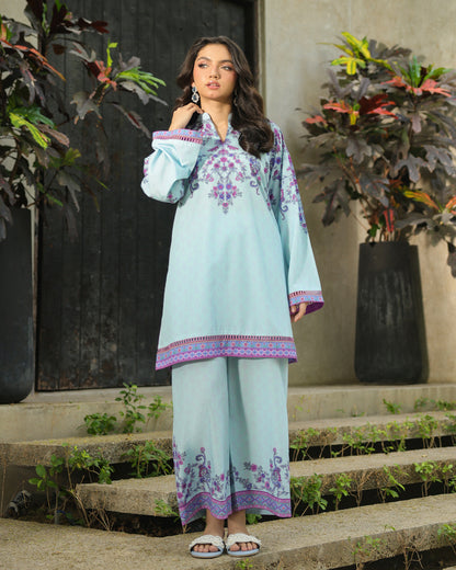 “Side view of ice blue kurta and pants with purple floral motifs – women’s co-ord set”