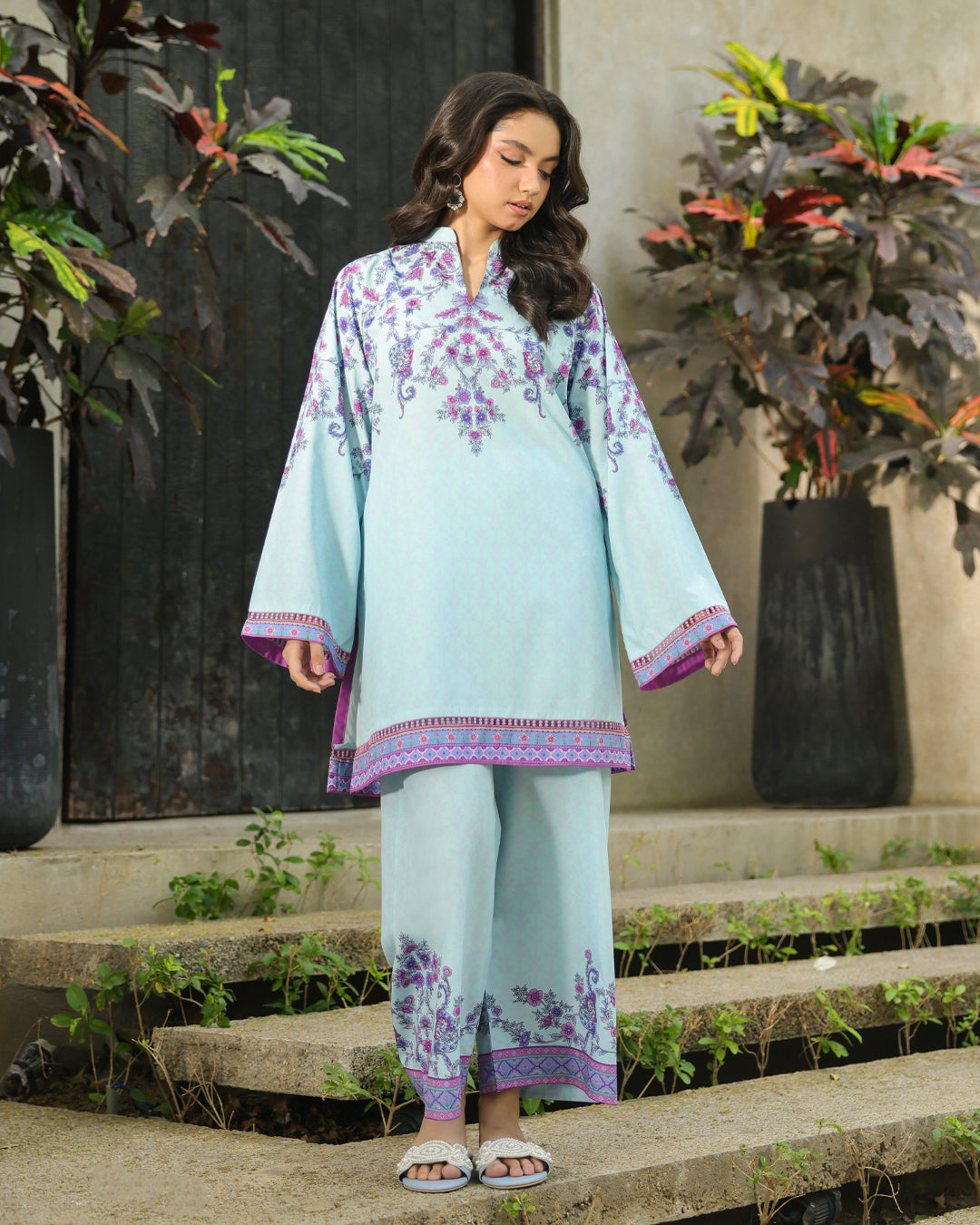 “Model leaning against wall wearing ice blue floral co-ord set – women's outfit”