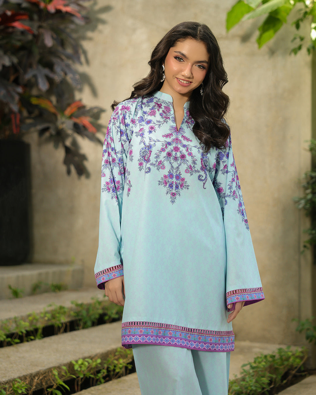 “Close-up of neckline and sleeve print on ice blue floral co-ord set”