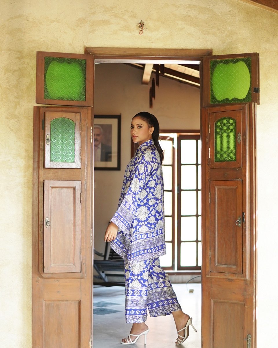 "Model wearing PoshBella Calm Chaos Printed Co-ord Set NXG06 in premium Korean BSY fabric with blue floral print, stylish relaxed-fit silhouette, perfect for travel and festive wear."