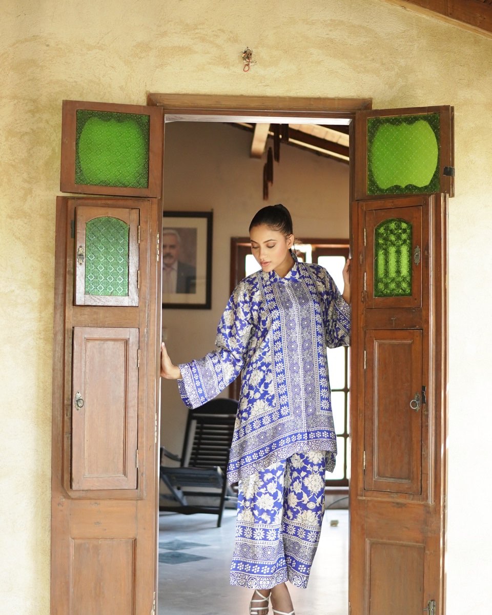 "Front view of PoshBella Calm Chaos Printed Co-ord Set NXG06 featuring statement blue floral print, mandarin collar top and straight-fit pants in Korean BSY fabric for elegant everyday style."