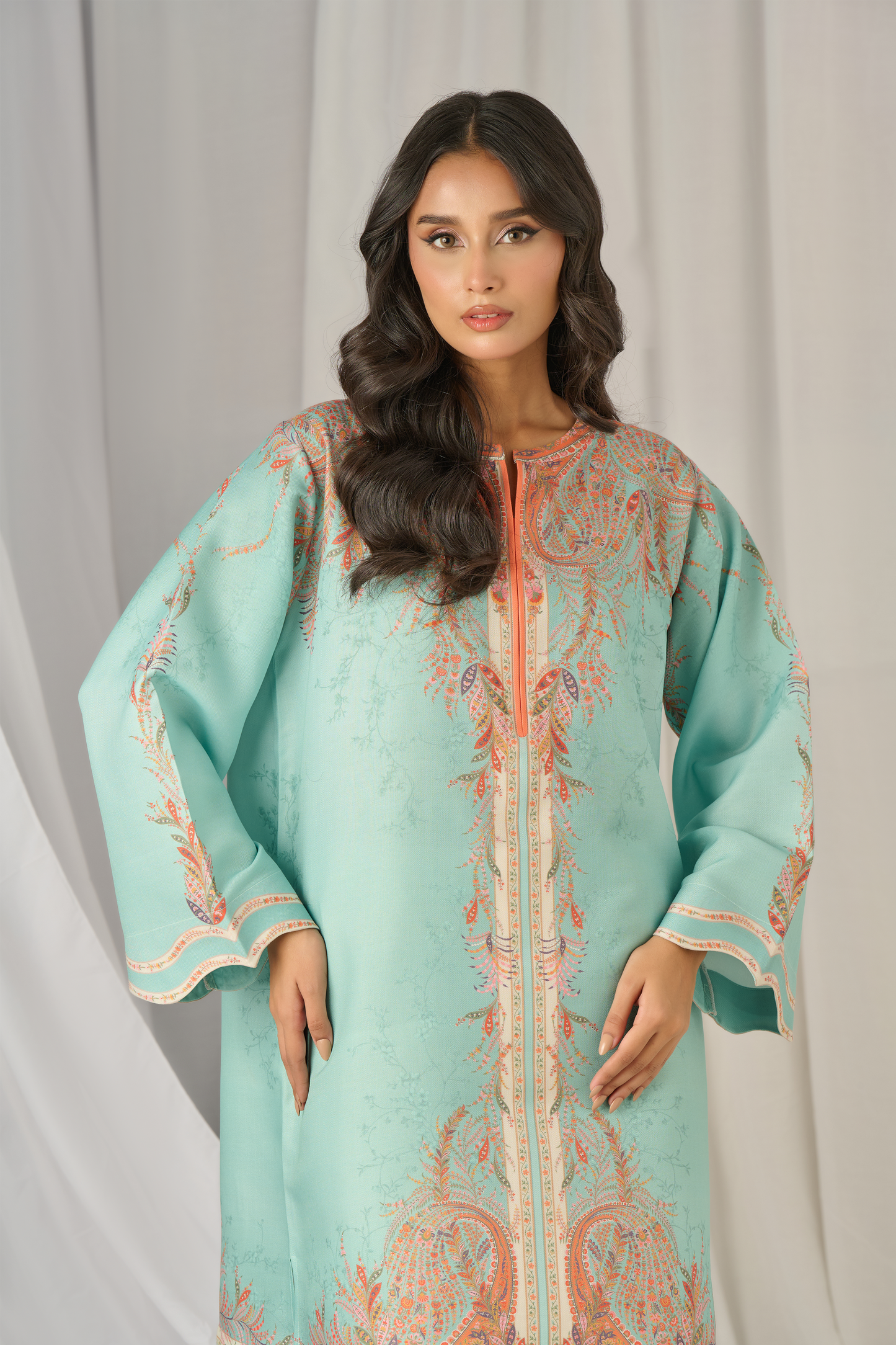 "Model in PoshBella NXG07 Minimal Printed Elegant Co-ord Set seated gracefully, displaying pastel aqua kurta with printed cream trousers—an elegant festive and pre-wedding outfit option."