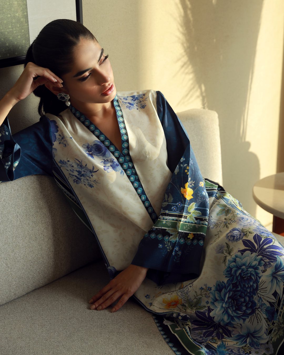 Sitting pose wearing aqua printed kurta and cream printed pants – women’s co-ord set