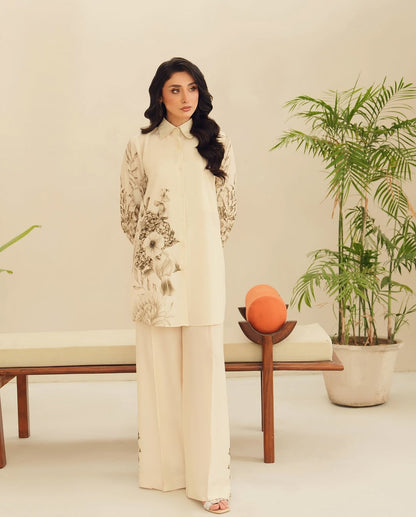 “Woman sitting in premium soft Korean floral co-ord set, perfect for wedding mornings, bridal get-ready moments, bridesmaid outfits, and sophisticated formal wear.”