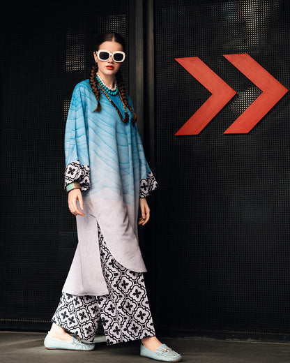 blue printed linen kurta set for women, designer festive kurta set with statement sleeves, blue and lavender printed kurta with floral wide leg pants, premium linen kurta set for festive wear, modern ethnic kurta set for women, stylish Rakhi and Diwali kurta set, designer printed kurta with wide leg pants, festive ethnic outfit for women, contemporary Indian kurta set, statement sleeve festive kurta set