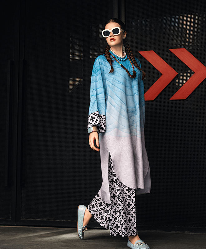 blue printed linen kurta set for women, designer festive kurta set with statement sleeves, blue and lavender printed kurta with floral wide leg pants, premium linen kurta set for festive wear, modern ethnic kurta set for women, stylish Rakhi and Diwali kurta set, designer printed kurta with wide leg pants, festive ethnic outfit for women, contemporary Indian kurta set, statement sleeve festive kurta set