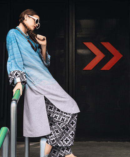 blue printed linen kurta set for women, designer festive kurta set with statement sleeves, blue and lavender printed kurta with floral wide leg pants, premium linen kurta set for festive wear, modern ethnic kurta set for women, stylish Rakhi and Diwali kurta set, designer printed kurta with wide leg pants, festive ethnic outfit for women, contemporary Indian kurta set, statement sleeve festive kurta set