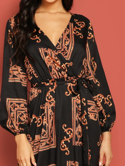Black dress with intricate orange patterns on a red background