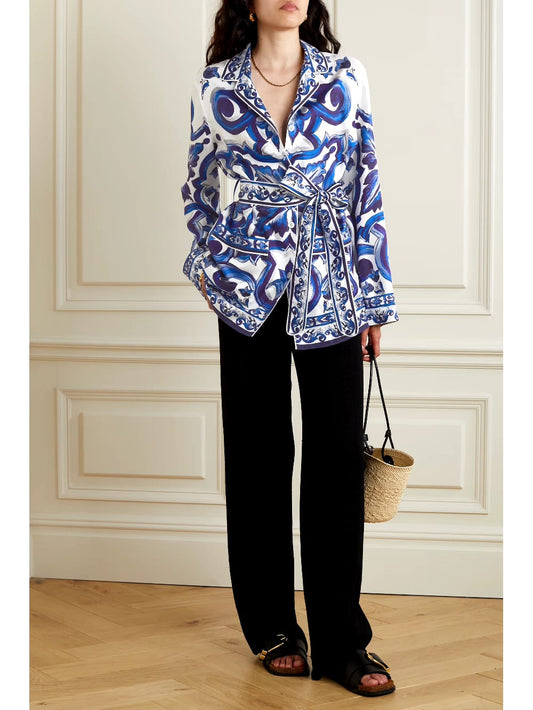 blue printed satin shirt, satin shirt for women, blue baroque print shirt, white and blue shirt, women’s designer shirt, printed formal shirt, button-down shirt for women, belted shirt for women, statement shirt, elegant office wear, smart casual shirt, premium satin shirt, stylish western wear, party wear shirt, PoshBella fashion