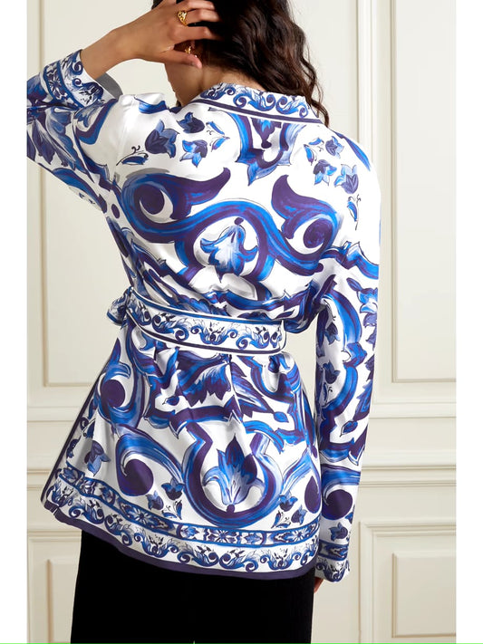 blue printed satin shirt, satin shirt for women, blue baroque print shirt, white and blue shirt, women’s designer shirt, printed formal shirt, button-down shirt for women, belted shirt for women, statement shirt, elegant office wear, smart casual shirt, premium satin shirt, stylish western wear, party wear shirt, PoshBella fashion