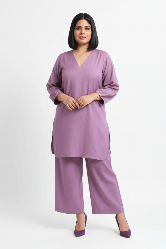 Woman wearing a purple outfit on a white background