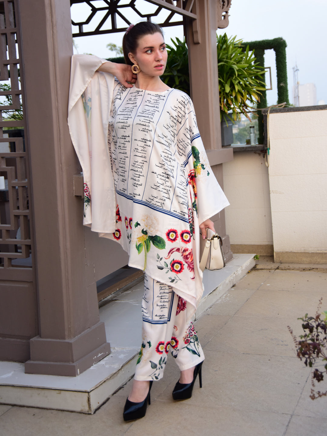 "Woman wearing a floral and script print cotton co-ord set – stylish and elegant outfit for women by PoshBella, perfect for casual and festive wear."