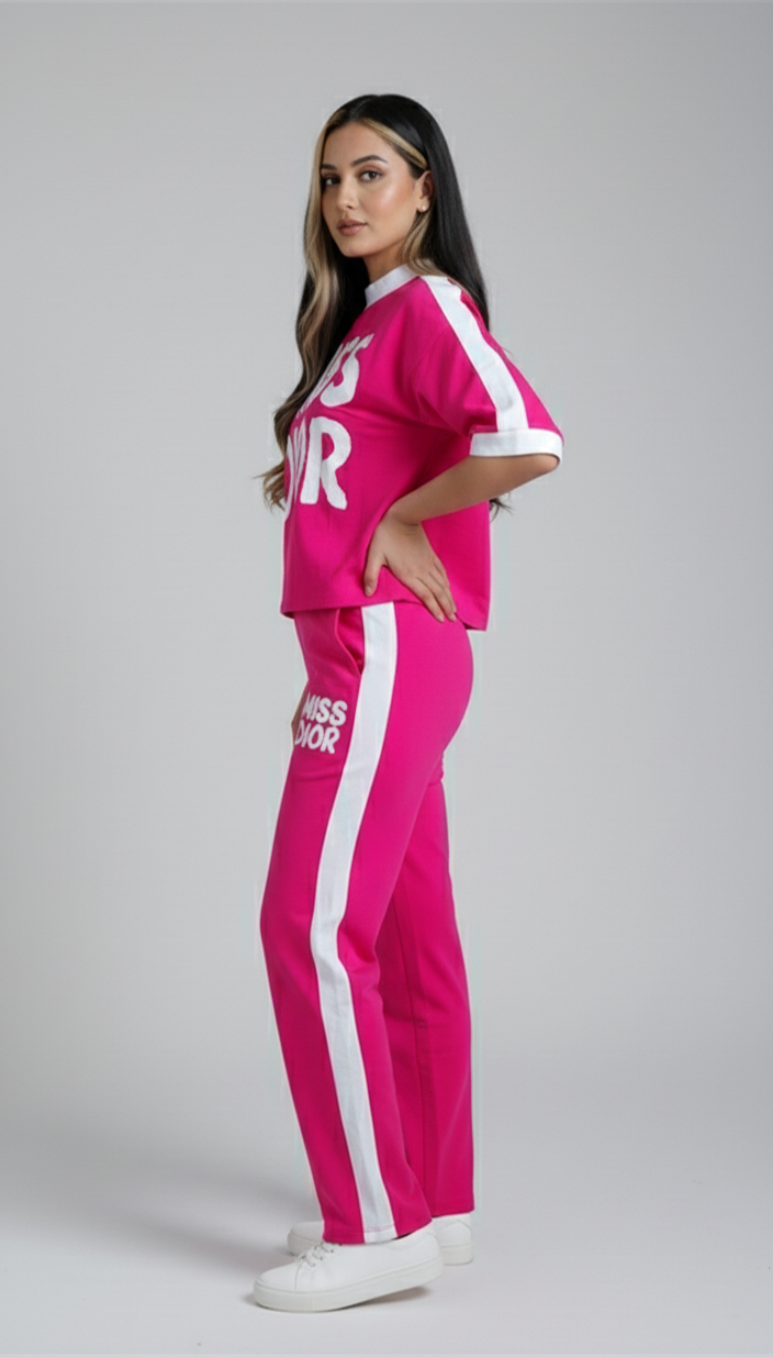 Trendy women’s hot pink co-ord set featuring bold Miss Dior graphic tee and matching jogger pants for casual wear.