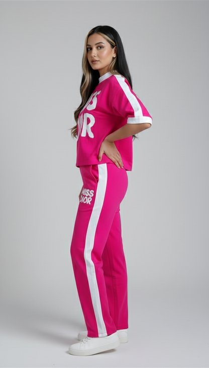 Trendy women’s hot pink co-ord set featuring bold Miss Dior graphic tee and matching jogger pants for casual wear.