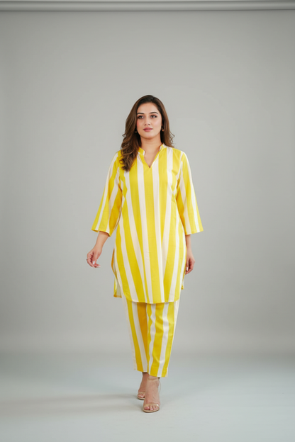 Woman wearing a yellow and white striped outfit on a plain background