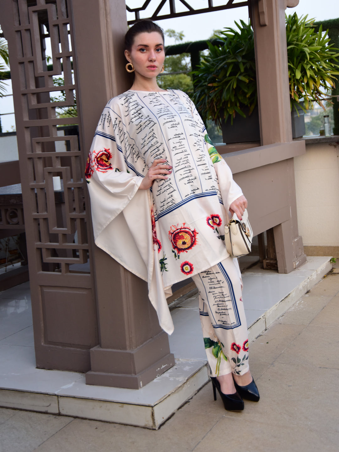 "Woman wearing a floral and script print cotton co-ord set – stylish and elegant outfit for women by PoshBella, perfect for casual and festive wear."