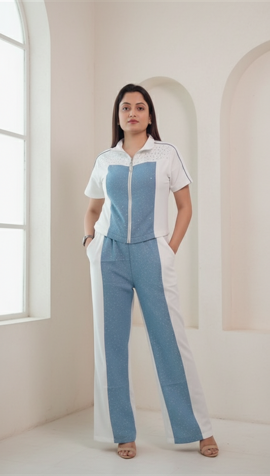 Woman wearing a denim cotton co-ord set with front zip collared top and straight pants