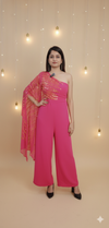Woman wearing hot pink one-shoulder sequin jumpsuit with draped sleeve and wide-leg fit for party wear, Diwali Dress, Festive Dress