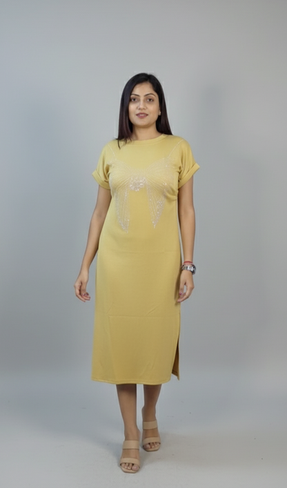 Woman wearing mustard yellow embellished midi dress with rolled sleeves