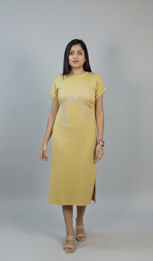 Woman wearing mustard yellow embellished midi dress with rolled sleeves