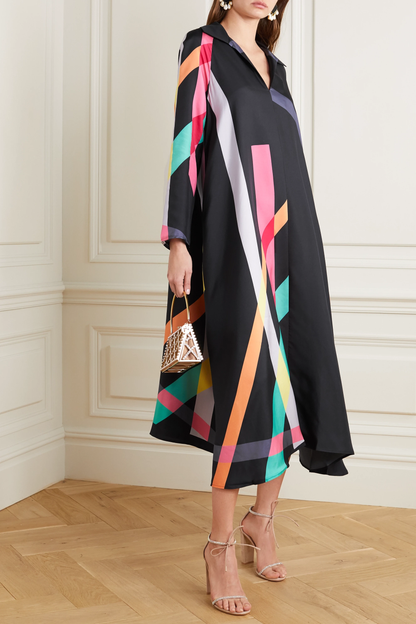 Model wearing black silk crepe dress with bold multicolor stripes – elegant cocktail and festive wear by PoshBella.