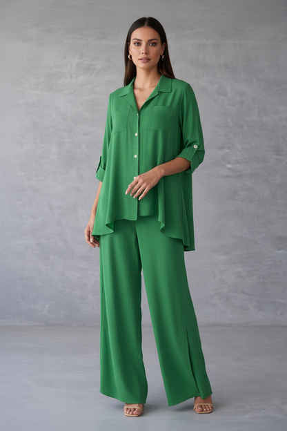 Woman wearing a green outfit against a gray background