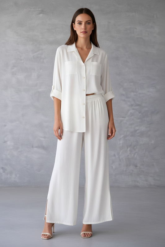 Woman wearing a white outfit against a gray background